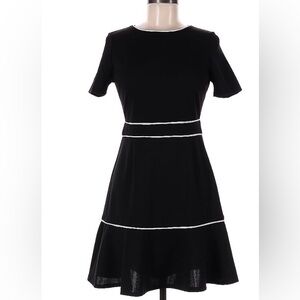 AQUA From Bloomingdales. Black with white trim. Size medium. Fitted with stretch